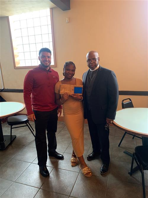 Eagle's Nest Stairclimber Damaya Carson with Bishop Dwane Brock and adult.